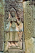 Angkor Thom - Bayon temple, central terrace, bas reliefs of the vestibule, apsara 